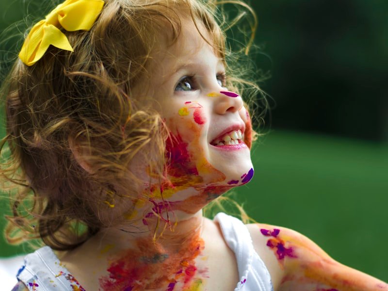 Smiling young child — joyful representation of fertility, prenatal and postpartum care